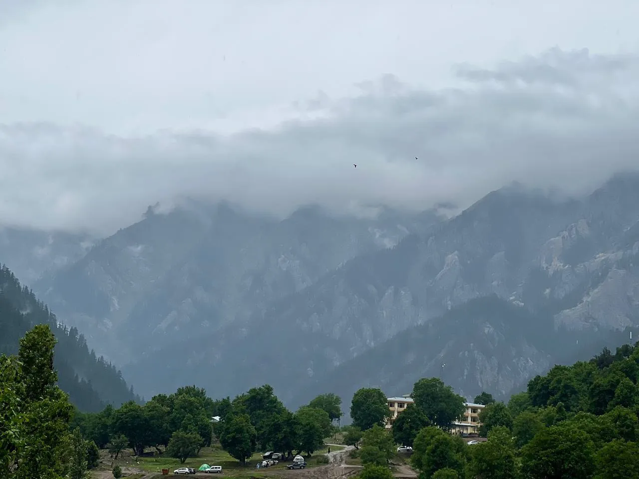 Natural scenery of Nuristan Province in eastern Afghanistan, showing forested mountains, rivers, and traditional villages in a remote landscape.