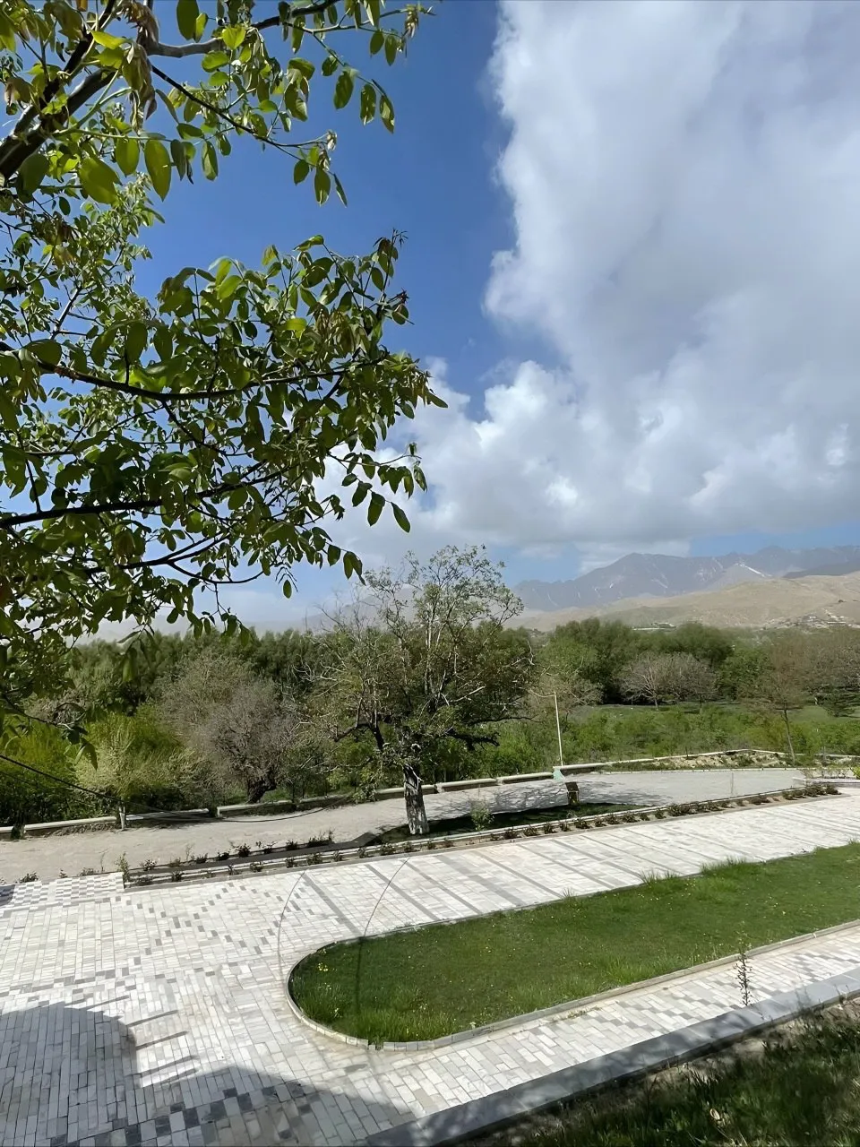 Jabal Saraj Palace in Parwan Province surrounded by mountains, rivers, and green landscapes, showing historical architecture and natural beauty of central Afghanistan.