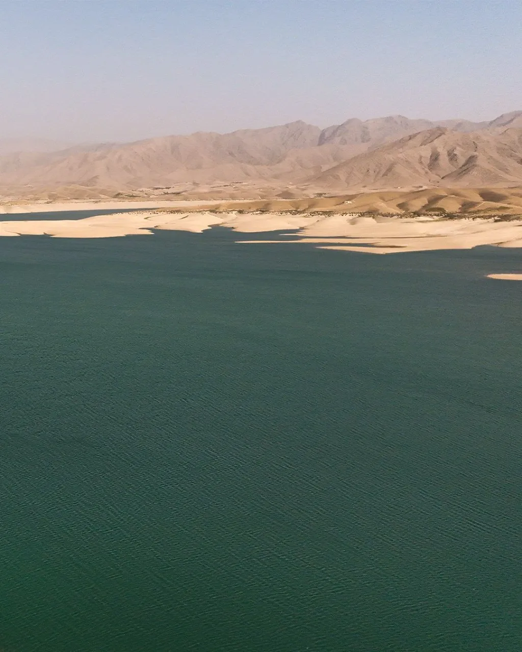 Kajaki Dam along the Helmand River in Helmand Province, showing water, surrounding mountains, and dramatic natural scenery in southern Afghanistan.